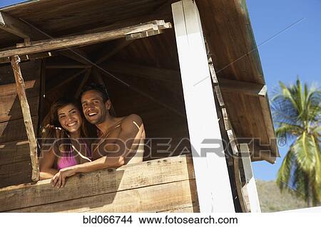 Couple in lifeguard tower View Large Photo Image Picture - Couple in lifeguard tower. Fotosearch