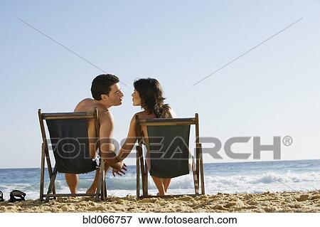 Couple kissing on beach View Large Photo Image Stock Photo - Couple kissing on beach. Fotosearch