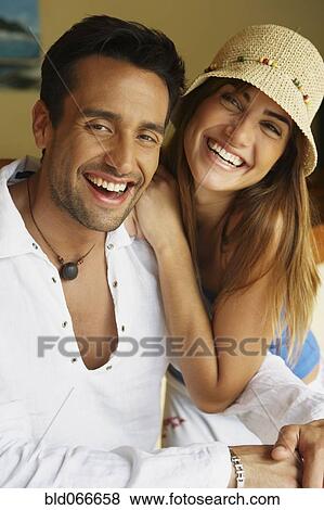 Couple laughing in bar View Large Photo Image Stock Photo - Couple laughing in bar. Fotosearch
