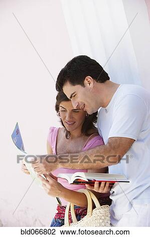 Couple looking at map View Large Photo Image Stock Image - Couple looking at map. Fotosearch