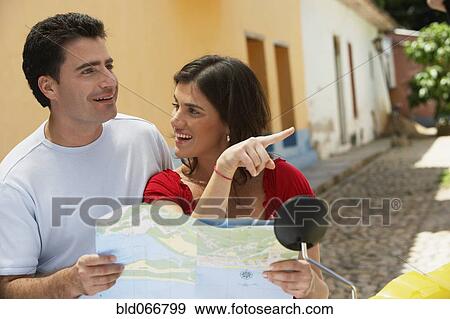 Stock Photo - Couple looking at map. Fotosearch