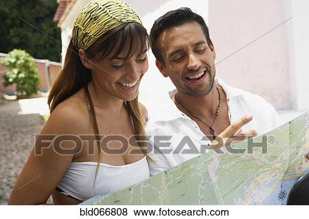 Stock Photo - Couple looking at map. Fotosearch