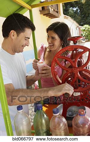 Couple making iced drinks View Large Photo Image Stock Photo - Couple making iced drinks. Fotosearch