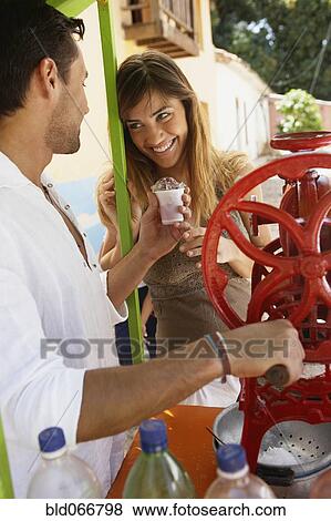 Stock Photo - Couple making iced drinks. Fotosearch