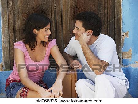 Couple sitting with suitcase View Large Photo Image Stock Photography - Couple sitting with suitcase. Fotosearch