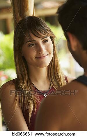 Couple smiling at one another View Large Photo Image Stock Image - Couple smiling at one another. Fotosearch