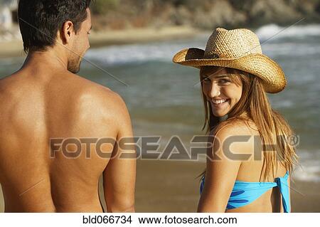Couple walking on beach View Large Photo Image Picture - Couple walking on beach. Fotosearch