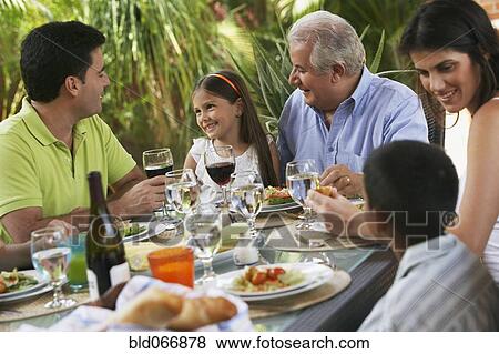 Family enjoying healthy lunch View Large Photo Image Stock Photo - Family enjoying healthy lunch. Fotosearch