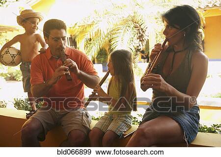 Stock Photo - Family playing musical instruments. Fotosearch