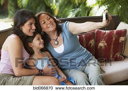 Grandmother, mother and daughter taking self-portrait View Large Photo Image Stock Image - Grandmother, mother and daughter taking self-portrait. Fotosearch