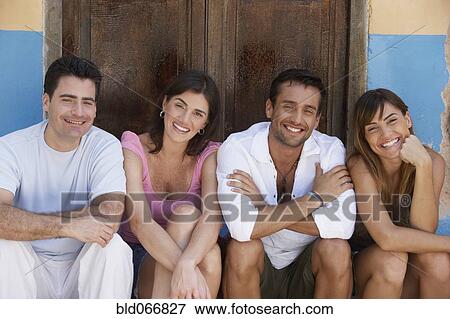 Happy couples smiling View Large Photo Image Stock Photo - Happy couples smiling. Fotosearch