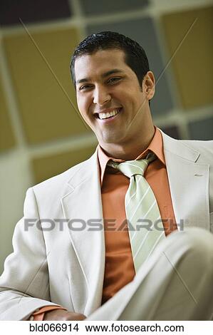 Picture - Hispanic businessman in suit. Fotosearch