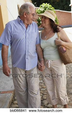 Hispanic couple holding hands View Large Photo Image Stock Image - Hispanic couple holding hands. Fotosearch