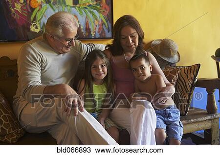 Hispanic grandparents sitting with grandchildren View Large Photo Image Stock Image - Hispanic grandparents sitting with grandchildren. Fotosearch