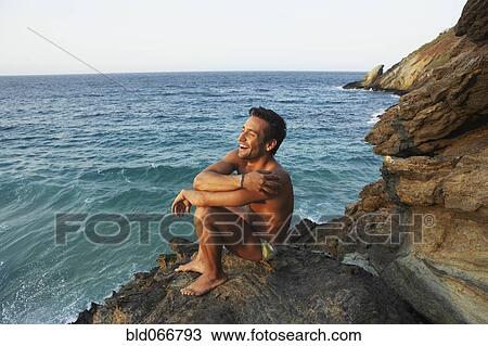 Man in bathing suit near ocean View Large Photo Image Stock Image - Man in bathing suit near ocean. Fotosearch