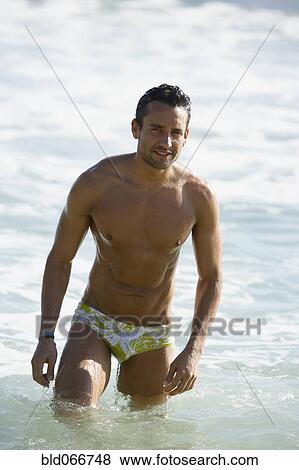 Man wading in ocean View Large Photo Image Stock Photo - Man wading in ocean. Fotosearch