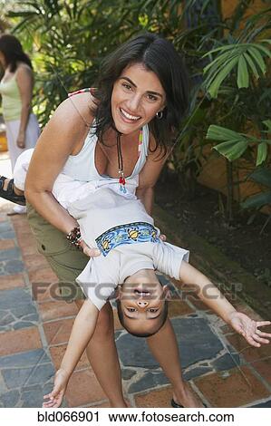 Mother playing with son View Large Photo Image Stock Image - Mother playing with son. Fotosearch