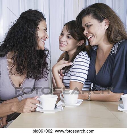 Stock Image - Multi-generational women drinking coffee. Fotosearch
