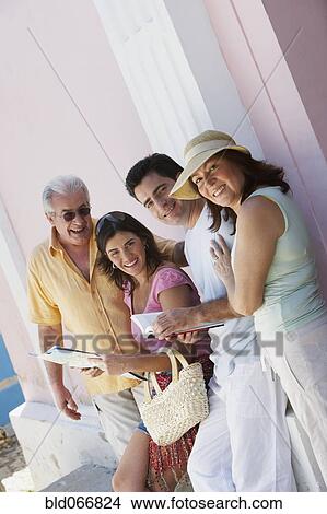 People looking at map View Large Photo Image Picture - People looking at map. Fotosearch