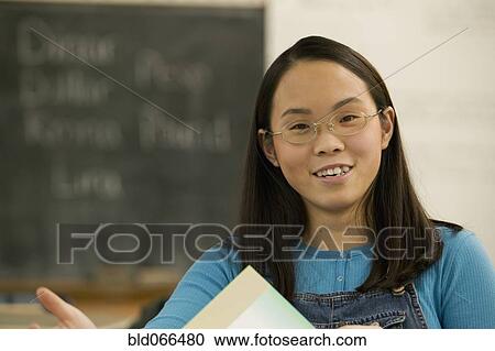 Portrait of Asian student in classroom View Large Photo Image Stock Image - Portrait of Asian student in classroom. Fotosearch