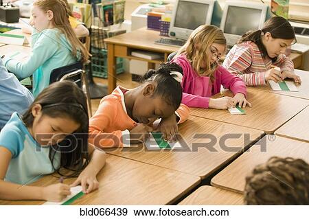 School girls making name cards View Large Photo Image Stock Photo - School girls making name cards. Fotosearch