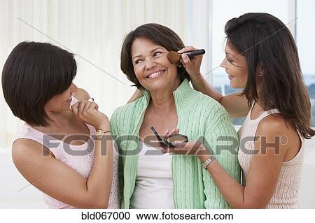 Sisters giving mother a makeover View Large Photo Image Stock Image - Sisters giving mother a makeover. Fotosearch