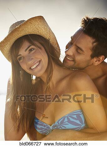 Stock Photo - Smiling couple hugging. Fotosearch