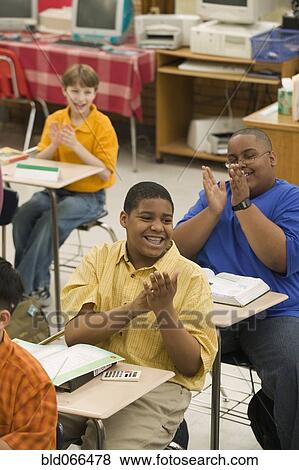 Students clapping in classroom View Large Photo Image Stock Photo - Students clapping in classroom. Fotosearch