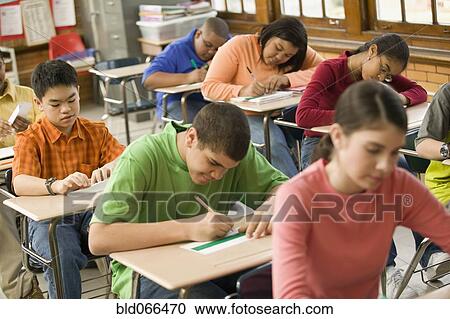 Stock Image - Students making name cards in classroom. Fotosearch