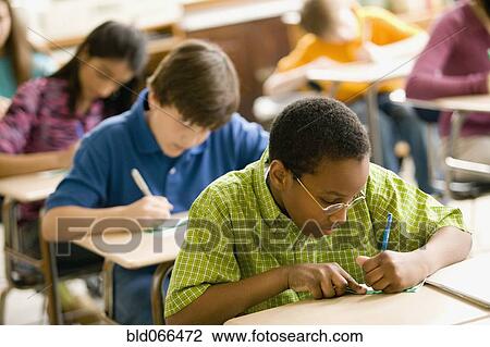 Students making name cards in classroom View Large Photo Image Stock Image - Students making name cards in classroom. Fotosearch