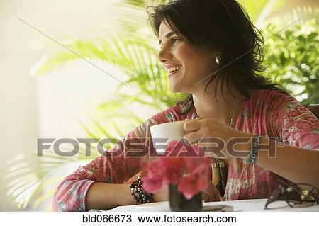 Woman drinking coffee in cafe View Large Photo Image Stock Image - Woman drinking coffee in cafe. Fotosearch