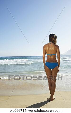 Picture - Woman in bikini at beach. Fotosearch