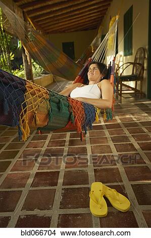 Woman laying in hammock View Large Photo Image Picture - Woman laying in hammock. Fotosearch