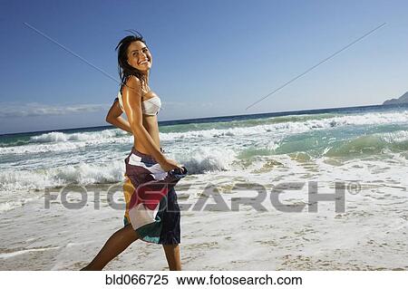 Woman running at beach View Large Photo Image Stock Photography - Woman running at beach. Fotosearch