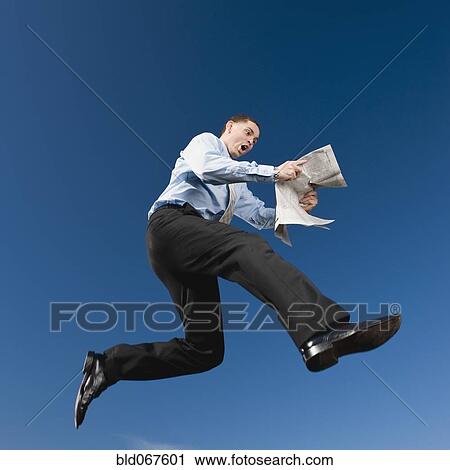 African businessman reading newspaper in mid-air View Large Photo Image Stock Image - African businessman reading newspaper in mid-air. Fotosearch