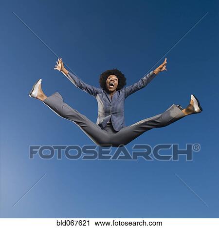 African businesswoman jumping in mid-air View Large Photo Image Stock Image - African businesswoman jumping in mid-air. Fotosearch