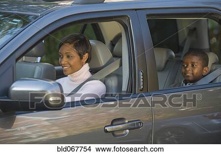 Picture - African mother and son driving in car. Fotosearch