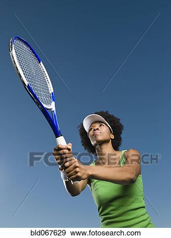 African woman playing tennis View Large Photo Image Stock Photo - African woman playing tennis. Fotosearch