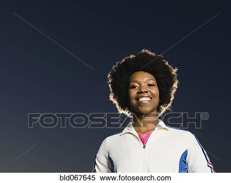 Stock Photography - Confident African woman smiling. Fotosearch