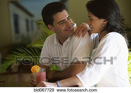 Couple drinking in bar View Large Photo Image Stock Photo - Couple drinking in bar. Fotosearch