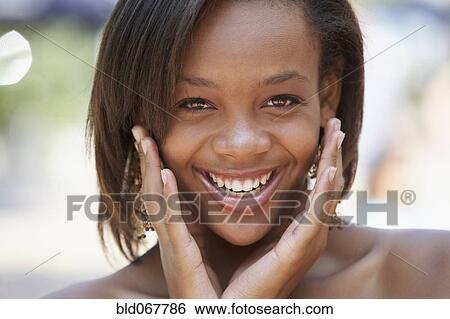 Stock Photograph - Grinning African teenager. Fotosearch