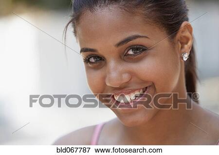 Hispanic teenager smiling View Large Photo Image Stock Photo - Hispanic teenager smiling. Fotosearch