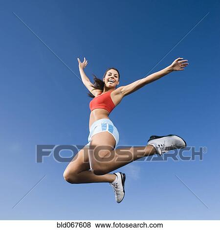 Native American woman jumping in mid-air View Large Photo Image Stock Photo - Native American woman jumping in mid-air. Fotosearch