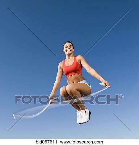 Native American woman jumping rope in mid-air View Large Photo Image Stock Image - Native American woman jumping rope in mid-air. Fotosearch