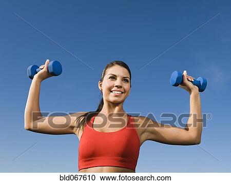 Native American woman lifting hand weights View Large Photo Image Stock Image - Native American woman lifting hand weights. Fotosearch