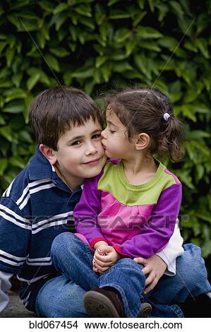 Sister kissing brother View Large Photo Image Picture - Sister kissing brother. Fotosearch