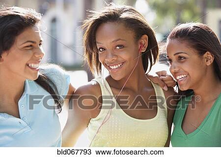Stock Image - Teenage friends hanging out together. Fotosearch