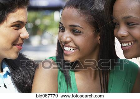 Teenage friends laughing together View Large Photo Image Stock Photo - Teenage friends laughing together. Fotosearch