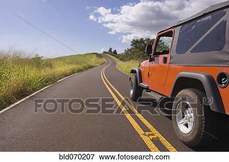 4x4 driving on remote road under blue sky View Large Photo Image Stock Photo - 4x4 driving on remote road under blue sky. Fotosearch