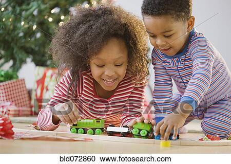 African American brother and sister playing with toy train View Large Photo Image Stock Image - African American brother and sister playing with toy train. Fotosearch